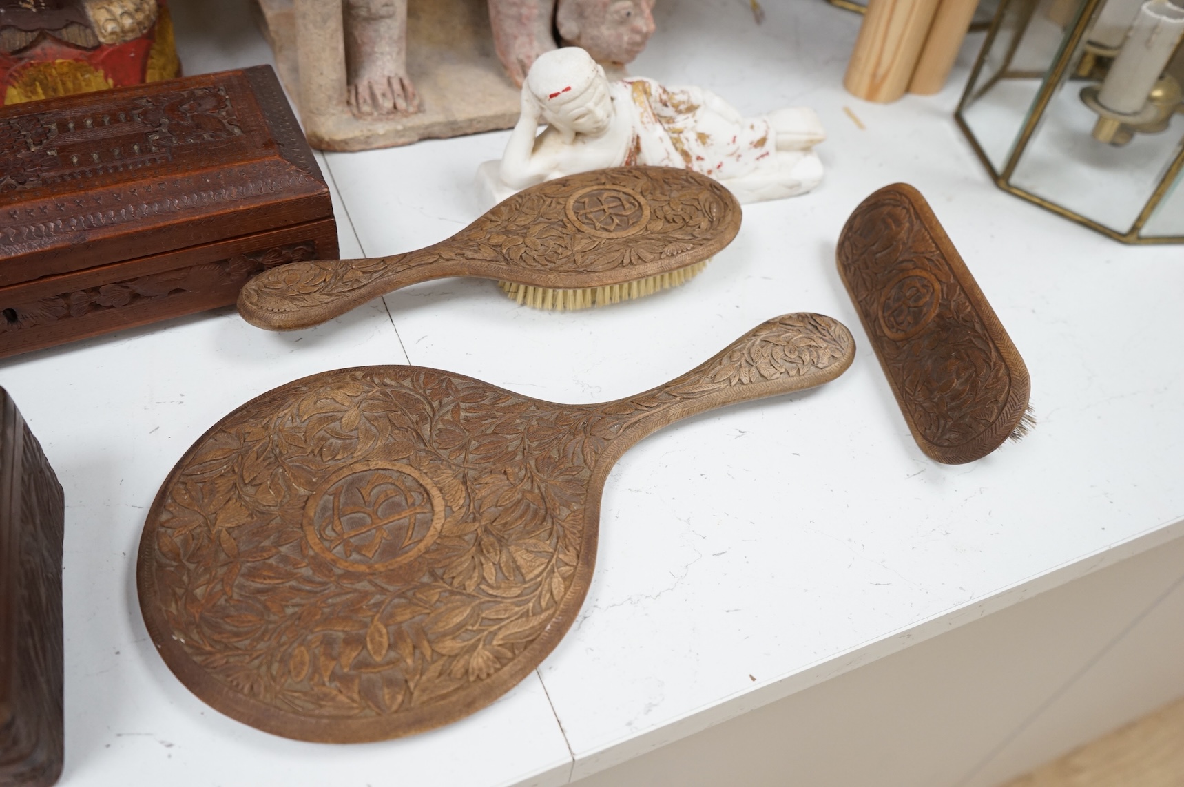 Eight south-east Asian carvings and a mounted bone, tallest 43cm